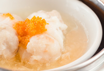 Steamed pork and shrimp dumplings with crab roe.