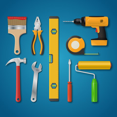 Set of vector realistic tools isolated on a blue background. Electric drill, hammer, pliers, paint roller, screwdriver, spanner, paintbrush, meter, spirit level. Hand tools for home renovation