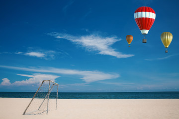 red hot air balloon with beach background