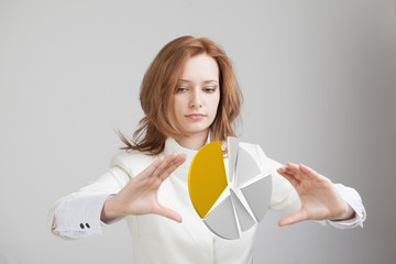 Woman shows a pie chart, circle diagram. Business analytics concept.