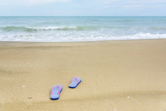 Flip-flops on the beach.