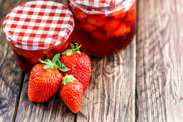 Strawberry jam on a wooden