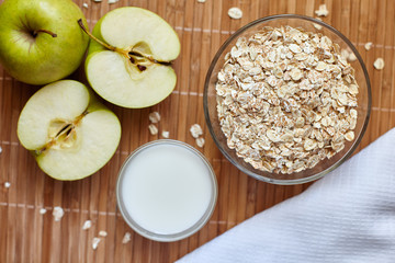 Breakfast. Oatmeal with milk, juice, banana, apple and lemon