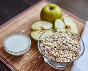 Breakfast. Oatmeal with milk, juice, banana, apple and lemon