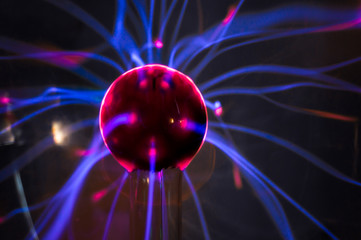 Plasma ball with magenta-blue flames