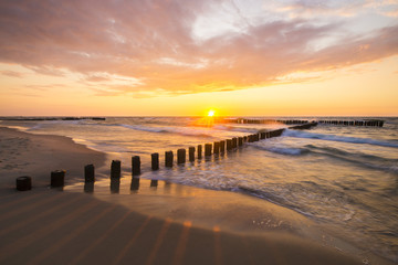 Obrazy  zachód słońca nad morską plażą