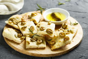 Homemade pizza with olives and olive oil
