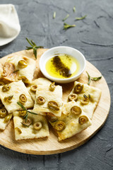 Homemade pizza with olives and olive oil