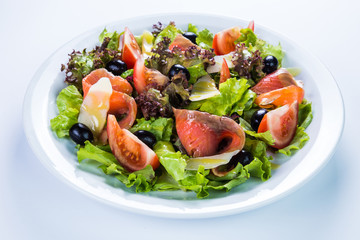 Fish salad - grilled salmon and vegetables. Restaurant food concept