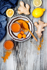 Carrot ginger immune boosting, anti inflammatory smoothie with turmeric and honey. Detox morning juice drink, clean eating