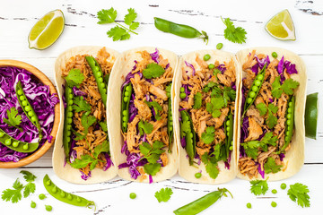 Mexican tacos with meat, peas and purple cabbage