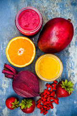 Healthy breakfast fruit smoothie with superfoods.  Mango goji berry smoothie with chia seeds