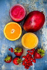 Healthy breakfast fruit smoothie with superfoods.  Mango goji berry smoothie with chia seeds