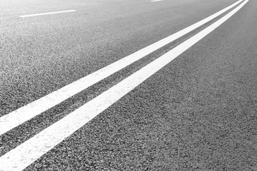 Asphalt road with marking lines white stripes