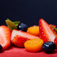 Fototapety  Many fresh berries on bright mousse cake. Selective focus. Shall