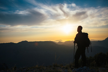 Back view of unrecognizable mountaineer