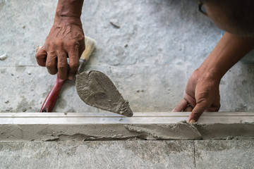 Workman plaster at construction site
