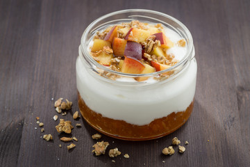 dessert with cream, granola and peach jam