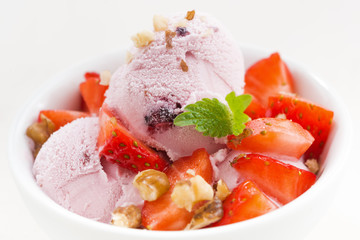 strawberry ice cream in a bowl, closeup