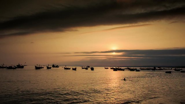 Fishing Boat Silhouettes in Sea Bay at Sunset in Vietnam