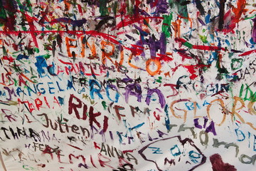 Children names painted in different colours on a white blanket