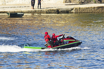 Fototapeta premium lifeguards in jet ski in rescue training