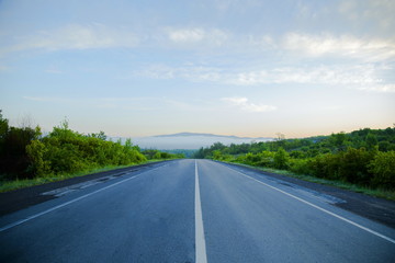 the road that leads to the mountains