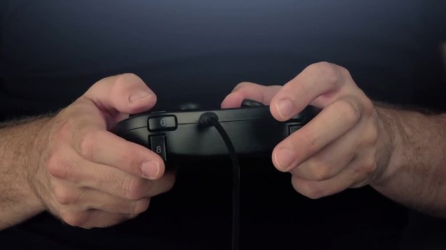 Time lapse of man playing video games with gamepad controller, gaming and entertainment concept