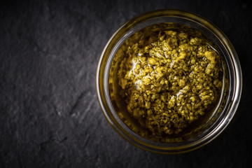 Pesto sauce in the glass jar  top view