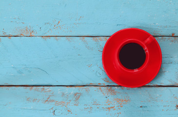 image with cup of coffee on blue wooden table