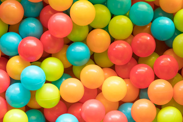 Fototapeta na wymiar Bright and Colorful toy balls, kids ball pit background, softpla