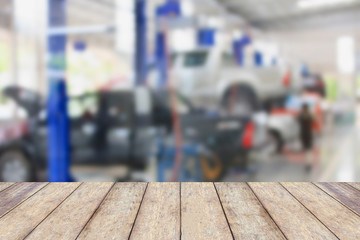 Wood table top with blur garage background
