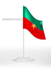 National waving flag of Burkina Faso on a pole. vector 3d country national symbol on a white background
