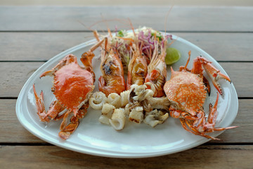 seafood of Grilled on wooden table at the beach