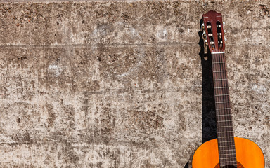 Fototapeta na wymiar Guitar leaning on wall.