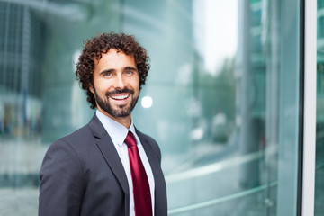 Fototapeta premium Handsome smiling businessman