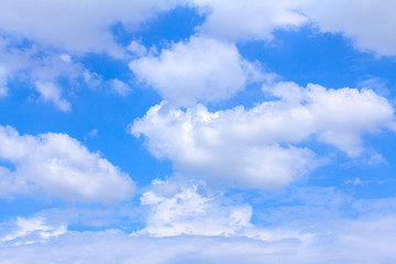 Blue sky background with white clouds. The vast blue sky and clouds sky on sunny day. White fluffy clouds in the blue sky. beautiful clouds and blue sky.
