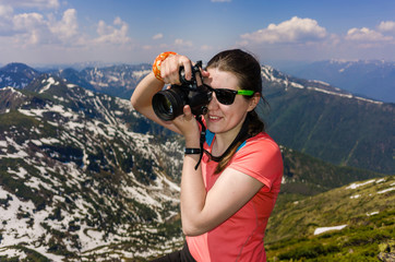 girl tourist on background of mountains