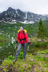 girl tourist on background of mountains