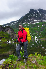 girl tourist on background of mountains