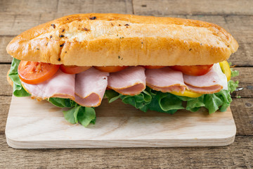Food series : Baguette ham sandwich on wooden board