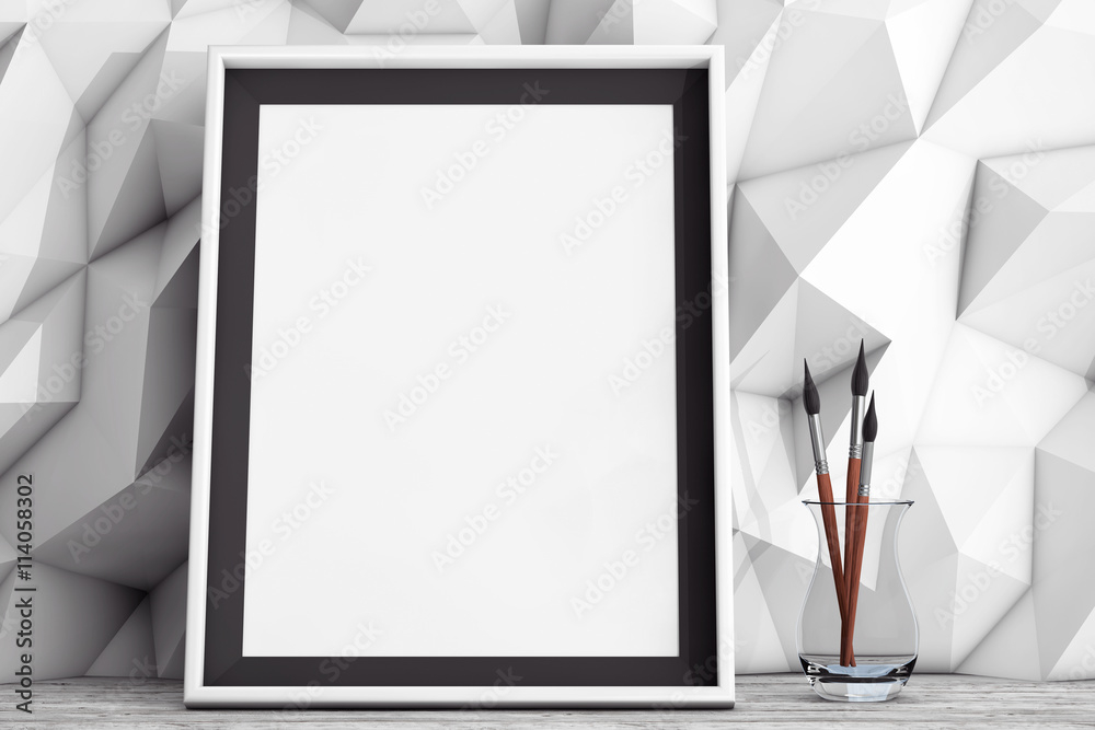 Poster blank picture frame with brushes in front of low polygon decorat