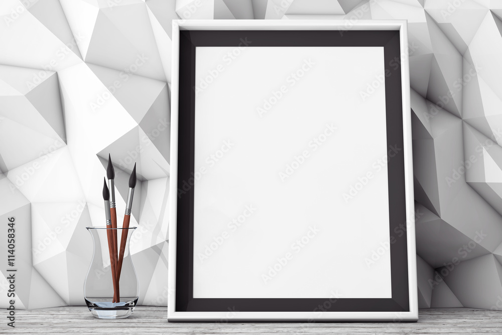 Poster blank picture frame with brushes in front of low polygon decorat