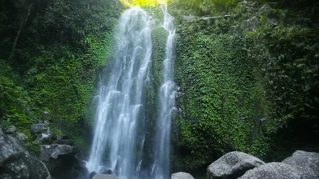Waterfall in the jungle.tropical rain forest with waterfall.Waterfall on the island of Camiguin (Philippines) 