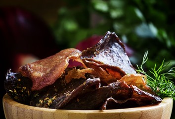 Uncooked jerked sausages meat chips, from a beef, pork and chick