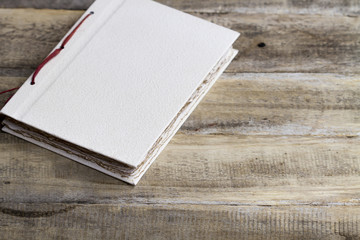 vintage style old paper book blank on old wood
