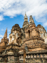 Fototapeta premium An ancient pagoda at Mahathat Temple in Sukhothai Historical Park, Sukhothai, Thailand. 