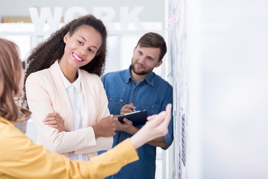 Showing approval for her colleague's brillant project brief