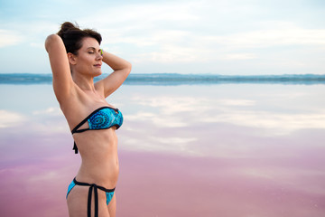 Pretty woman in a colorful lake