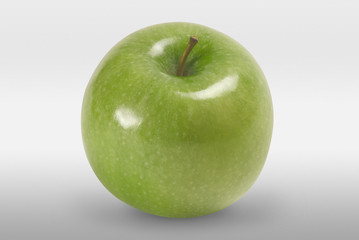 Green apple on white background. Front view.